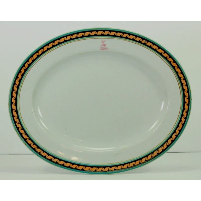 An interesting large oval ironstone platter It was most likely custom made to represent heritage heraldry symbols, which...