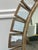 Large-scale round statement mirror featuring a dramatic sunburst-inspired frame composed of individually framed antiqued...
