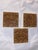 A rare and striking trio of antique relief-molded earthenware tiles manufactured by the celebrated J. & J.G. Low Art Tile...