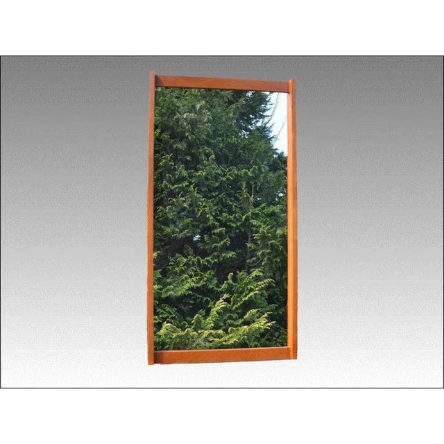 Mirror number 306 in teak frame designed by Kai Kristiansen for Aksel Kjaersgaard in the 1960s. The mirror is stamped by...