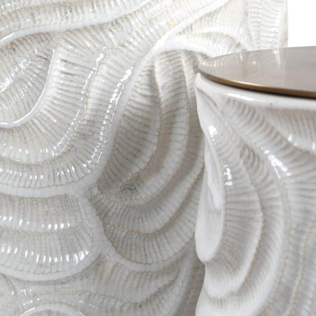 Bring sculptural elegance to everyday storage with this refined pair of ceramic canisters, featuring flowing, fossil-like...