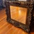 Large Baroque Rococo style wall mirror featuring an exceptionally ornate gilt frame with dramatic scrolling carvings,...