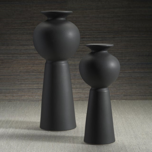 The Kyoto Modern Stoneware Vase exudes contemporary elegance with its sleek matte black finish. Designed to captivate,...
