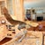 Sample description Dramatic oversized vintage brass eagle sculpture with outstretched wings perched on a naturalistic...