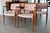 An exceptional and cohesive set of eight Danish modern dining chairs designed by Niels Otto Møller and produced by J.L....