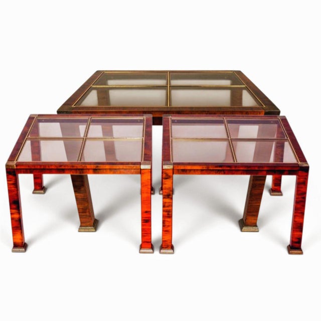 Rare 1970s Hollywood Regency flamed burl wood, copper, brass, and glass 4-Piece Table Set Elevate your living space with...