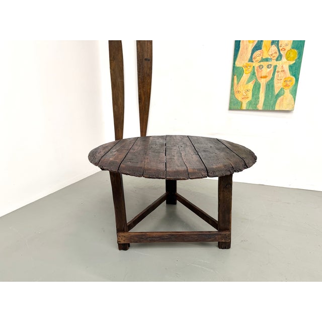Maison Lecan presents this round folk art oak table, circa 1880. A unique, powerful, and deeply expressive piece, a...