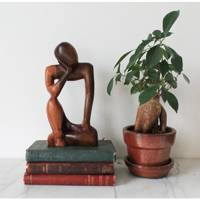 Mid-century abstract hand carved wood thinking figural sculpture. No makers mark. Minor age wear.
