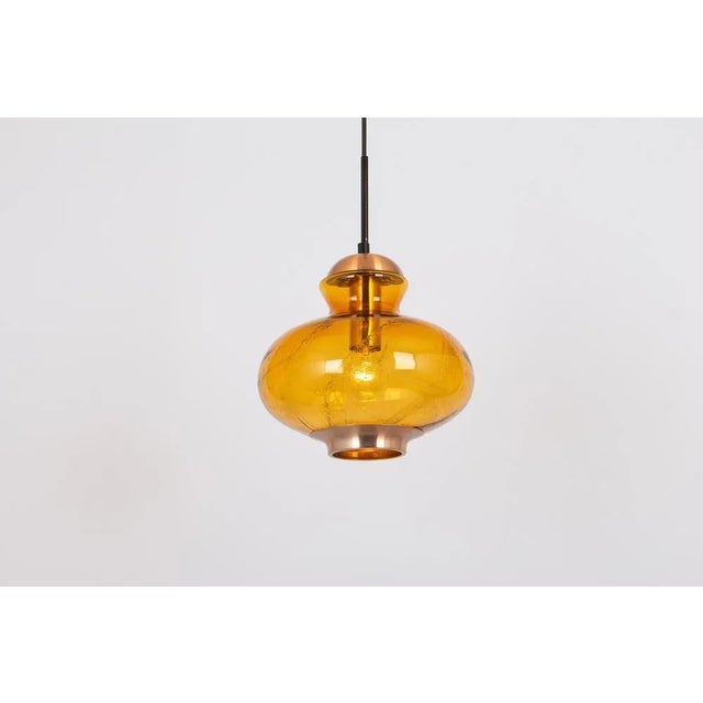 Petite doria pendant light with large volcanic murano glass ball. High-quality materials give a wonderful light effect...