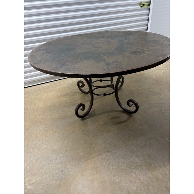 This exceptional hand-beaten copper dining table is a true statement piece, combining traditional metalworking...