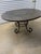 This exceptional hand-beaten copper dining table is a true statement piece, combining traditional metalworking...