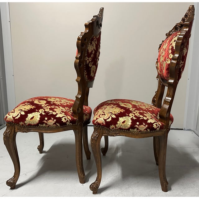 This pair of ornate, antique Italian Venetian-style side chairs (#3 of 3 available) feature extensive hand-carved details...