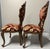 This pair of ornate, antique Italian Venetian-style side chairs (#3 of 3 available) feature extensive hand-carved details...