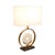 A circular piece of marble sits upright on the base further accentuated by a large gold metal ring surrounding it. This...