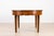 An exceptional and authentic Biedermeier dining table dating from the early 19th century, crafted from beautifully figured...