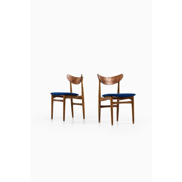 - Set of 6 dining chairs - Produced in Denmark -In oak & teak - Newly reupholstered in blue wool fabric - From the 50s