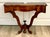 Here is a wonderful early mid-20th century wall-mounted console table with an especially beautiful sculptural silhouette....