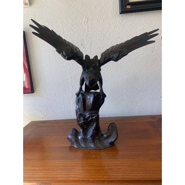 Beautiful antique Japanese cast iron eagle sculpture featuring articulated (hinged) wings and a stamped maker’s mark. This...