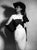 1951 Dress 14th April 1951: An off-the-shoulder evening dress with a black sash, accessorised with gloves and a veiled...