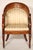 Pair of Charles X walnut inlaid bergeres, circa 1830. With barrel backs, inlaid crest rails. upholstered backs and seat,...