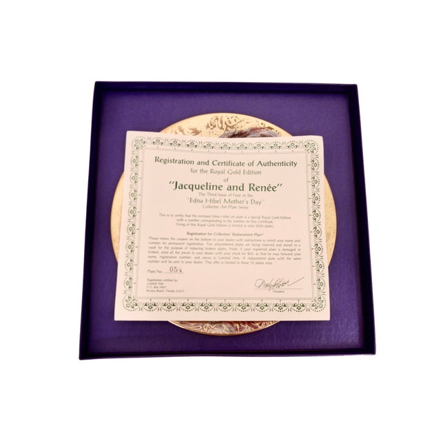 Gold encrusted decorative plate featuring a mother and child from the 1993 "Mother's Day" collection by Edna Hibel titled...