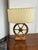 Design Plus Gallery presents a Rustic Wagon-Wheel Table Lamp. This table lamp showcases a wooden wagon-wheel base set on a...