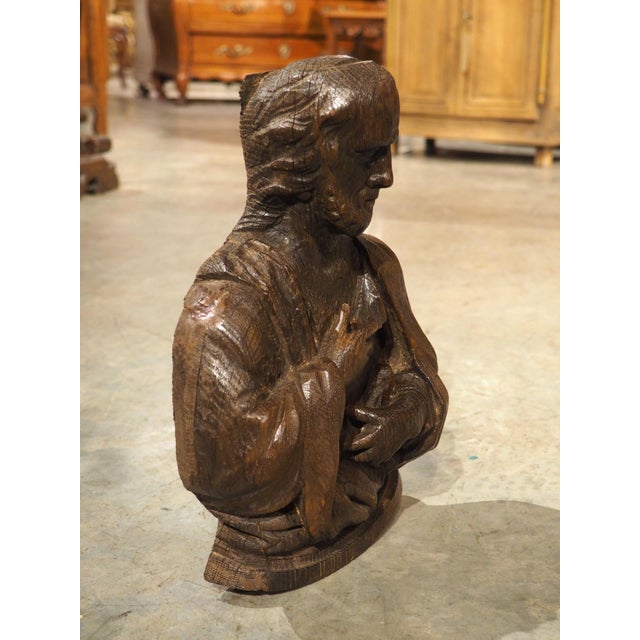 A small oak bust, dating to the 1600s, this well-carved wooden statue hails from France. Depicting an unknown religious...