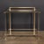 A vintage 20th century acrylic glass and brass console table by pierre vandel of paris, featuring two glass shelves. The...