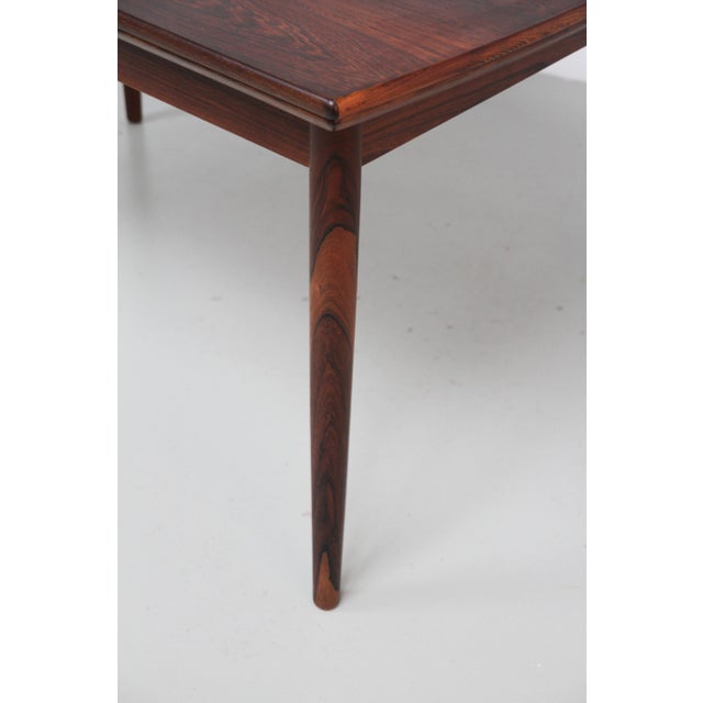 Danish Modern Expanding Rosewood Dining Table, 1960s. Scandinavian Mid-Century Modern rosewood/palisander dining room...