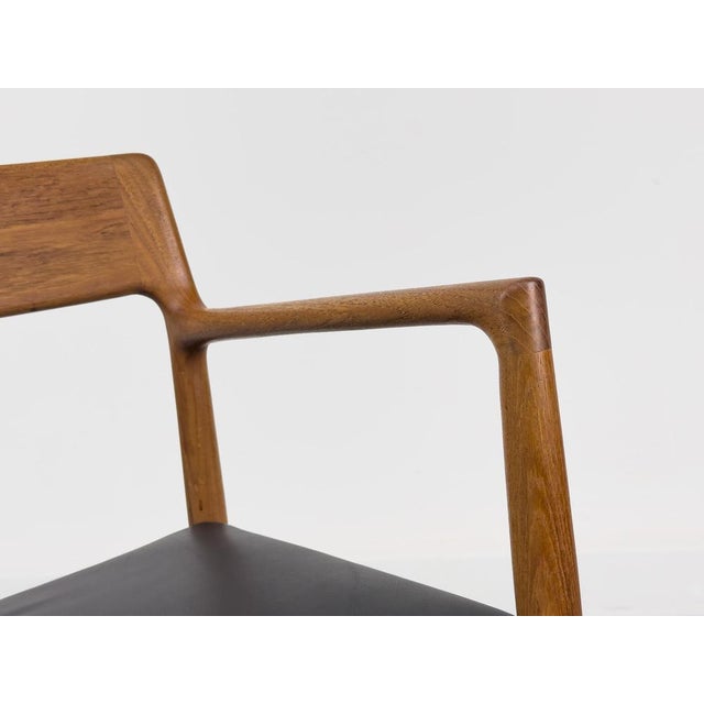 High-quality and very comfortable armchair made of solid teak with beautifully shaped armrests, manufactured in Denmark to...
