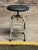 Nicely distressed paint adjustable height industrial stool. Painted steel frame with adjustable height seat. The seat has...
