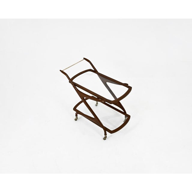 Italian wooden and brass trolley with a glass top. Wear consistent with age and age.