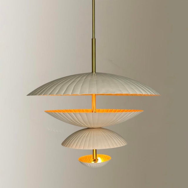 Elevate your space with this stunning ore handmade metal and brass chandelier. Made with meticulous craftsmanship, this...