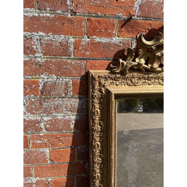 W: 99cm (39")h: 178cm (70.1")d: 5cm (2") a stunning large antique french 19th c gilt mirror, with ornate crest above and...