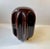 Weighing more than 10 kg this organically shaped odd looking porcelain object in brown glaze was originally installed as a...