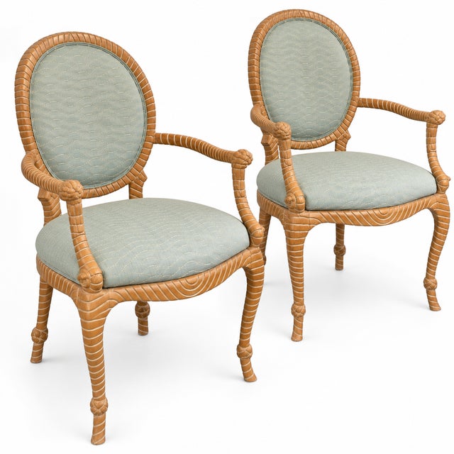 This is a pair of 1970s French Napoleonic style carved rope bergere chairs. The seafoam embroidered is vintage, and there...