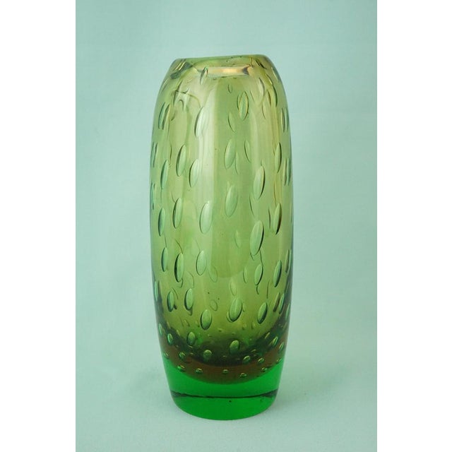A fantastic Murano blown pulegoso glass vase with large bubbles, crafted using the sommerso technique, joining a central...