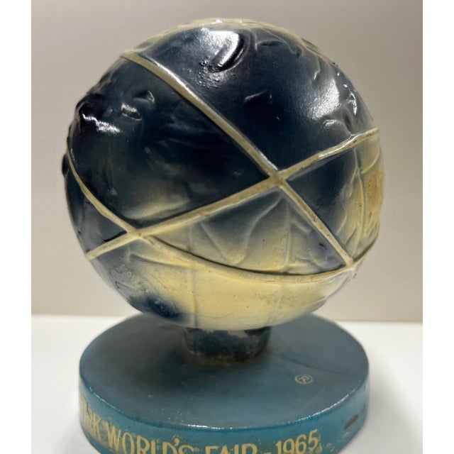 Official souvenir of the 1964-65 New York World's Fair. Unisphere bobble head on stand with spring inside. Blue and white...