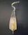 Vintage Italian wall light with a teardrop shaped Murano glass diffuser blown in clear and white color decorated with...