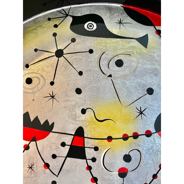 In the style of expressionist MCM Joan Miro, this beautiful crafted tray with hand painted designs ( in pochoir printing...