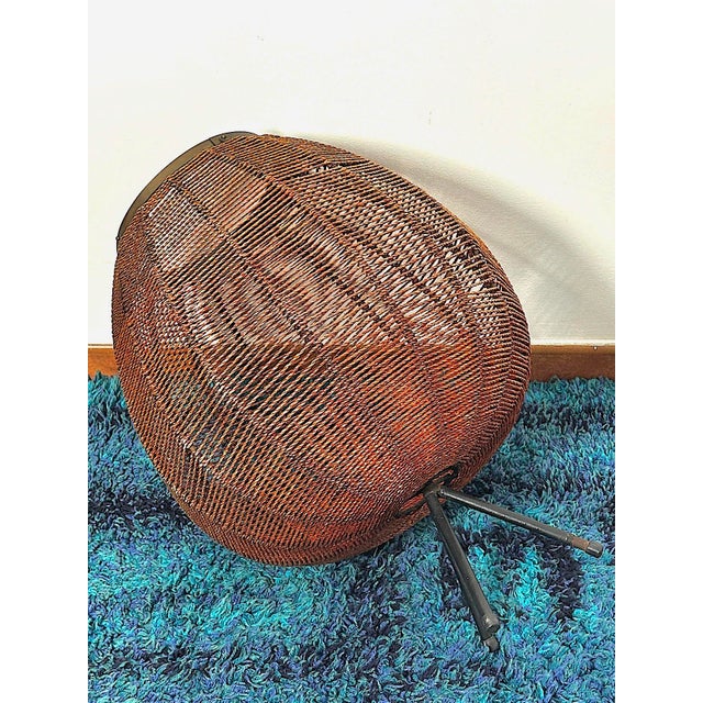 One-of-a-kind vintage magazine rack from the 1960s. This elegant magazine rack dating back to the 1960s is perfect for...