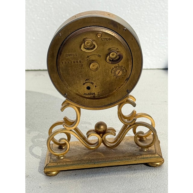 Vintage Bucherer Swiss Desk Clock – Mother-of-Pearl Dial, Ornate Gilt Stand, Alarm Function This beautifully crafted...