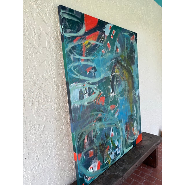 In “Turmoil,” movement and emotion collide in a storm of layered color and texture. Swaths of red/orange, blue, and green...