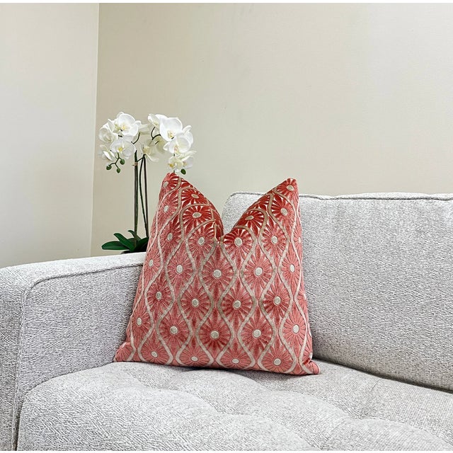 The spiced coral velvet throw pillow is a stunning addition to any home. The red-orange shade of the fabric adds a warm...