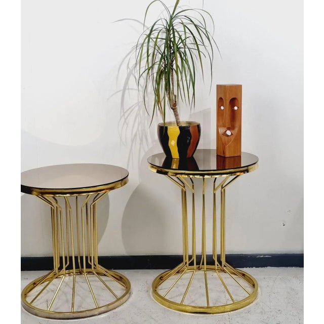 Exclusive round gold-colored storage table with glass top. Place of origin: Italy, circa 1980s. An elegant accessory in a...