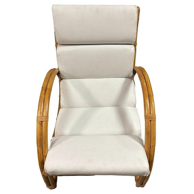 Original Paul Frankl inspired rattan lounge chair features a double-strand half-moon arm design with a curved stick rattan...