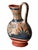 A sculptural Mexican pottery pitcher featuring a wide-eyed owl on one side and a bold stylized flower on the reverse. Deep...