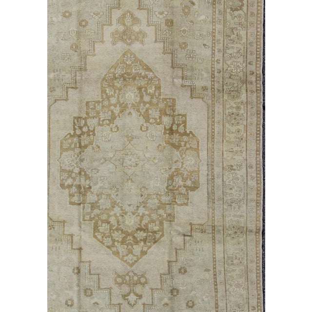 Measures: 6'11 x 10'8. Pale Colored Vintage Turkish Oushak Rug in Gray, Taupe, Cream and Light Brown 6'11 X 10'8. Keivan...