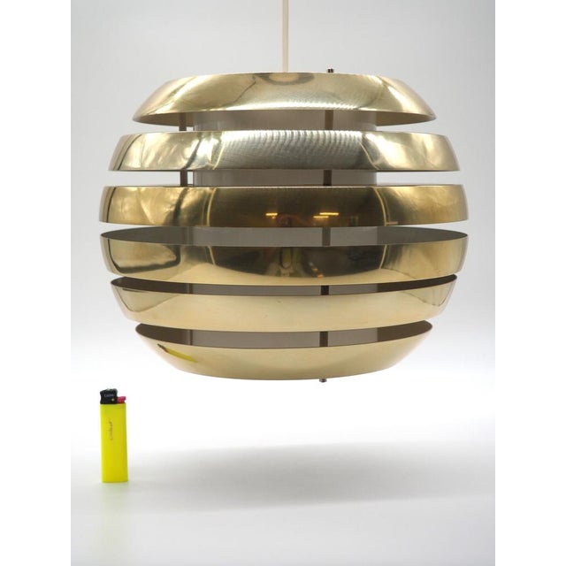 A very rare ceiling lamp by the designer carl thore. A clean and stylish lamp that shines with a warm pleasant glow...