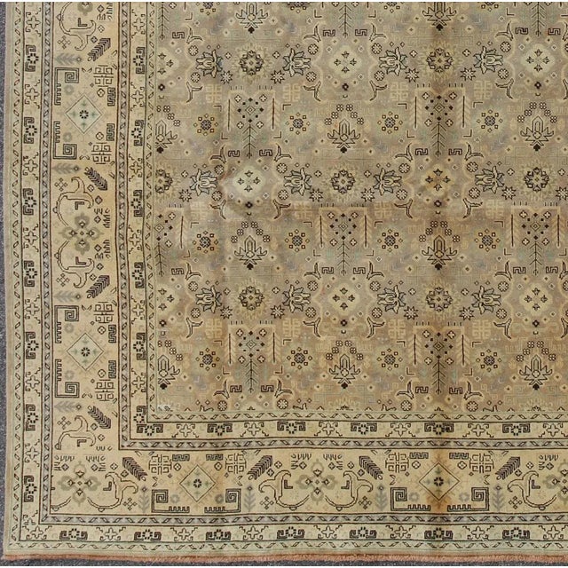 This lovely Semi Vintage Tabriz carpet bears an all-over sub-geometric design paired with a softly muted palette. The...